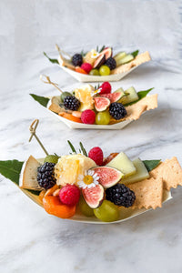 A trio of fresh garden to table single serve cheese grazing boats, filled with Vermont's finest cheese and the season's freshest fruits and vegetables accented with fresh flowers and herbs.