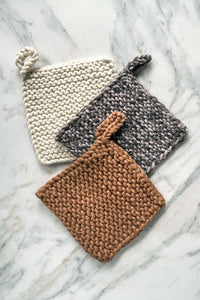 A trio of hand knit, natural dyed wool pot holders and trivets.