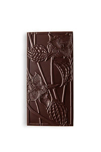 A Salted Caramel Chocolate Bar with sea salt that is pressed with a pattern of trillium flowers.